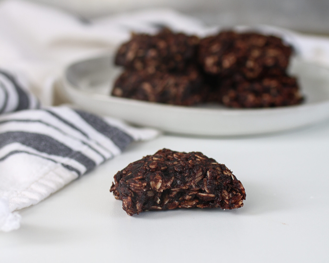 healthy no bake cookie with plate of cookies in the background