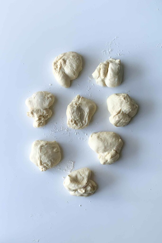 aerial view of bun dough cut into 8 sections