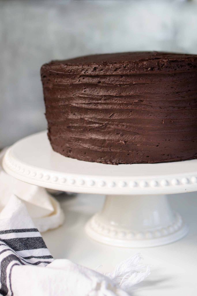 chocolate cake on white stand