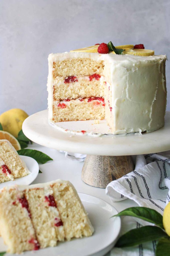 cut lemon cake with raspberries