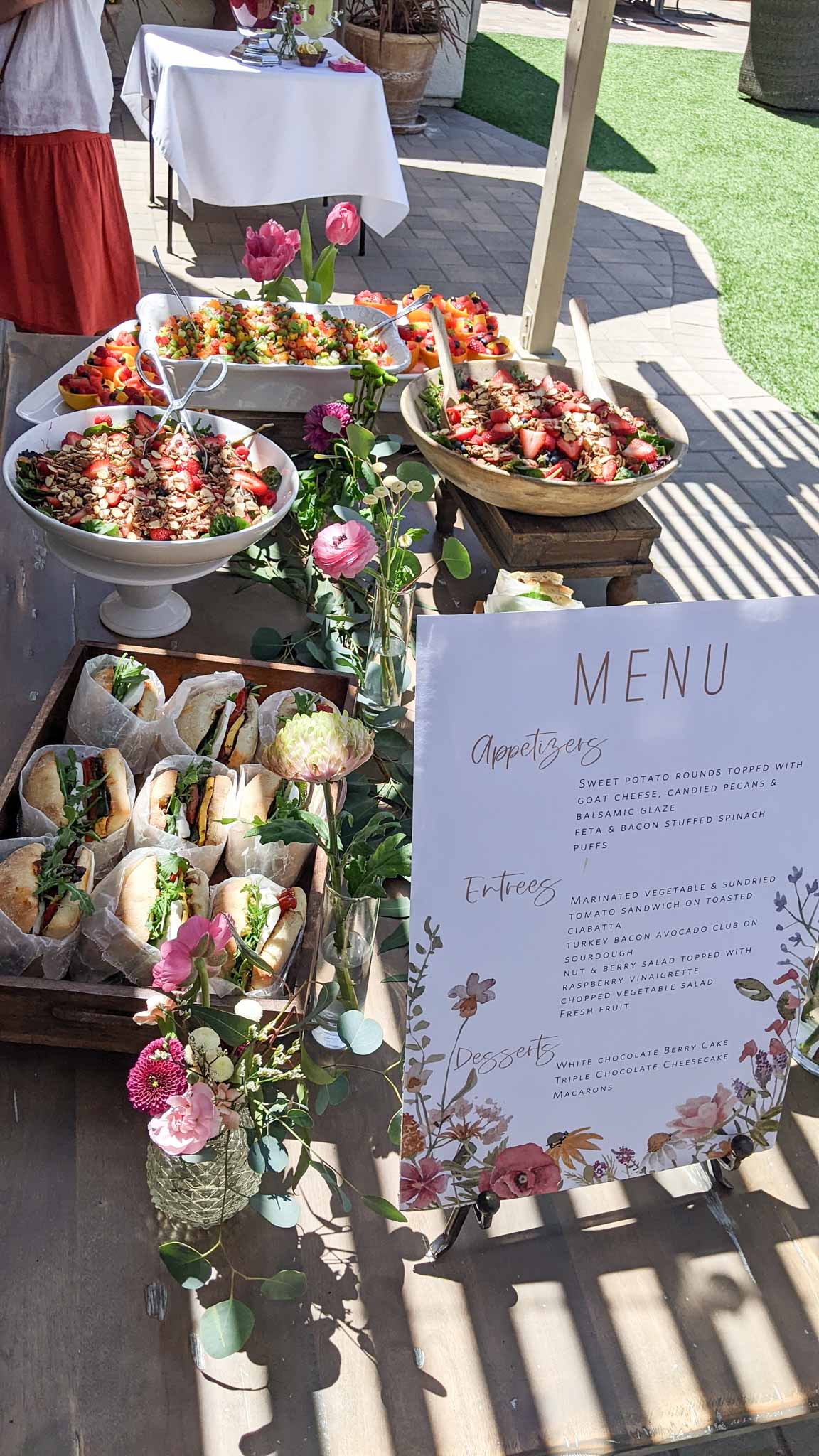 brunch table with food and sign