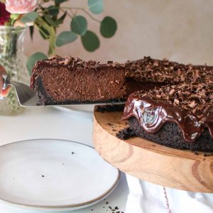 chocolate cheesecake slice with server