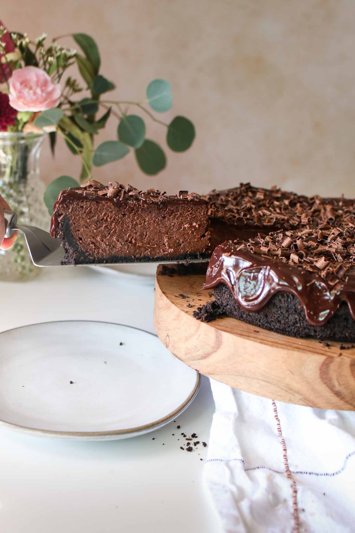 chocolate cheesecake slice with server