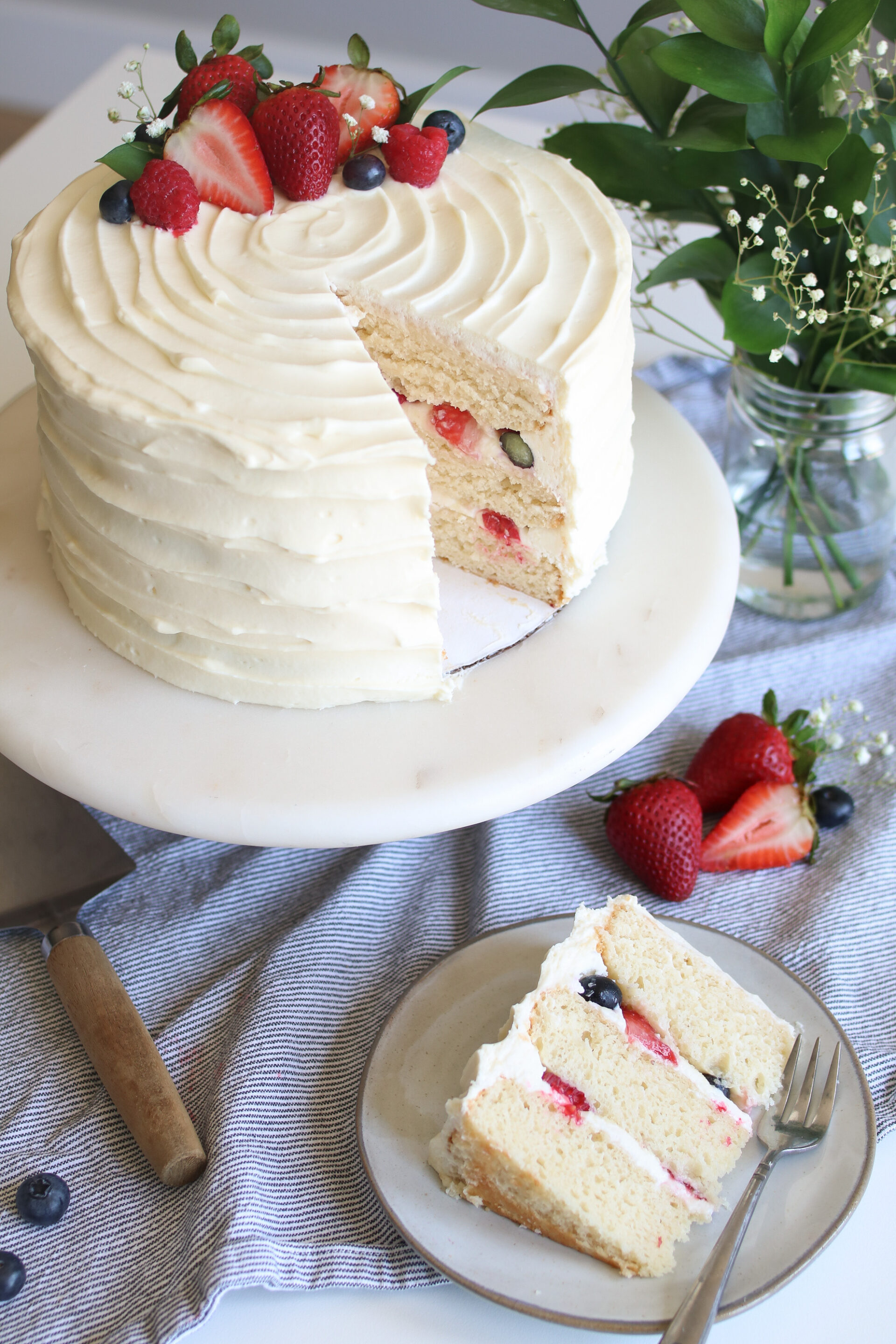 white chocolate berries and cream cake overhead