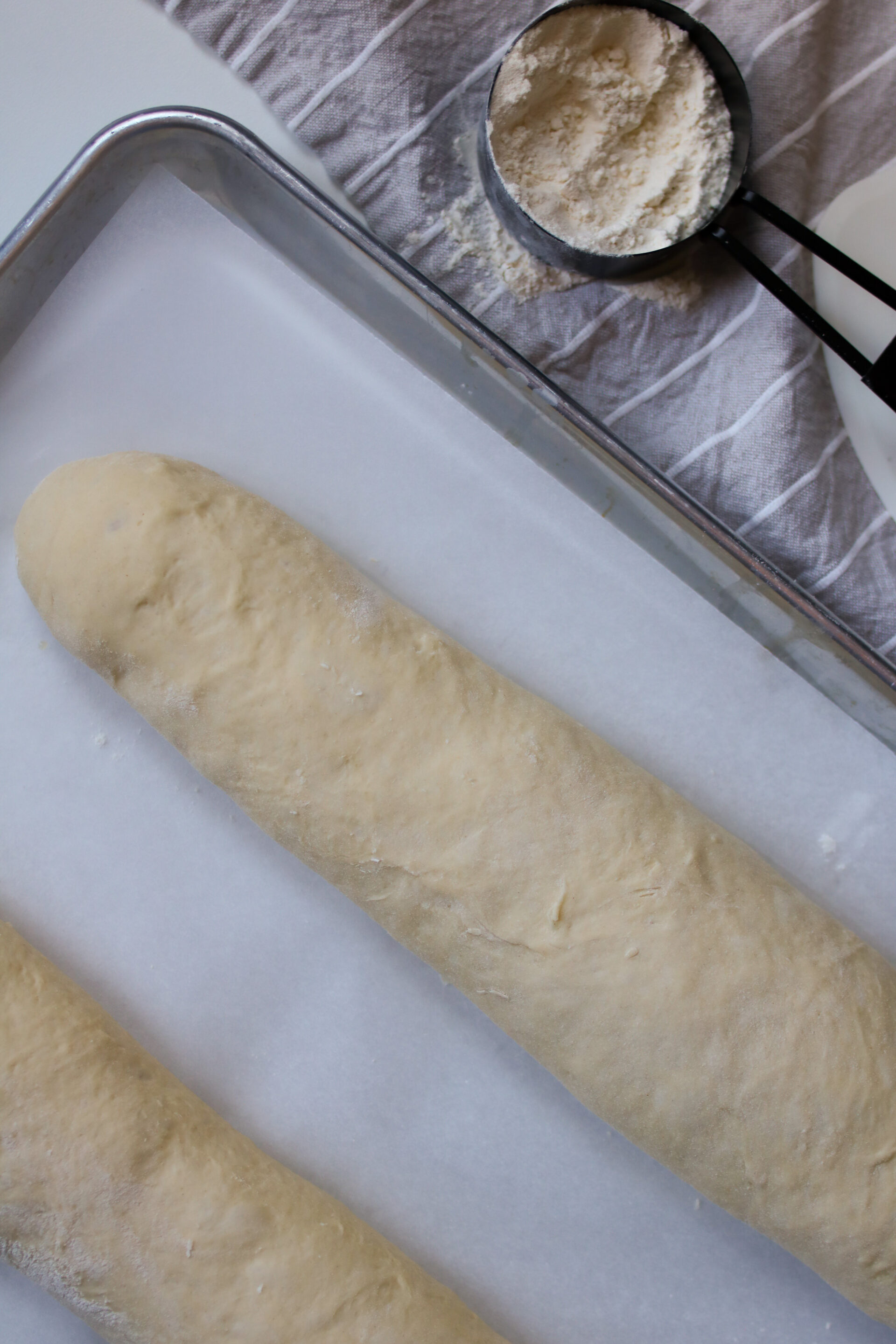 overhead view of uncooked french bread dough